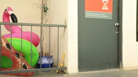 Pool floaties with covid sign Video stock 136395473