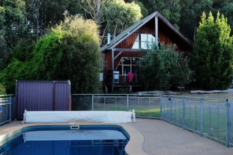 Pool in front of a Cottage Stock Photos