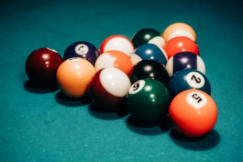 Pool game - balls in triangular shape on a table Stock Photos