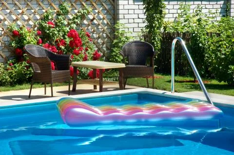 Pool with inflatable mattress. Stock Photos