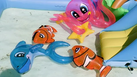 Pool with inflatable toys Stock Footage 94118563