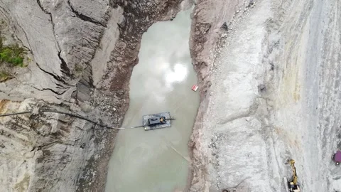 The pool inside the mine is drained by a pump Stock Footage 169944317