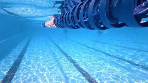 Pool lane divider sliding past underwater camera in swimming pool Stock Footage 342157425