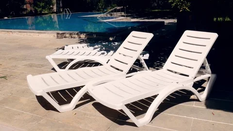 Pool Lounge Chairs 1 Video stock 83928862