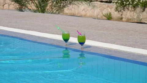 Pool party. A young bald modern caucasian man with mustache, beard in sunglas 库存影片 132662708