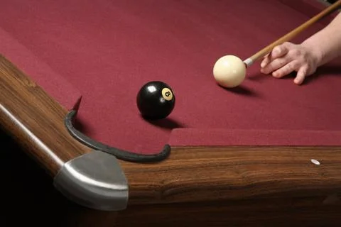 Pool player lining up balls for winning shot Stock Photos