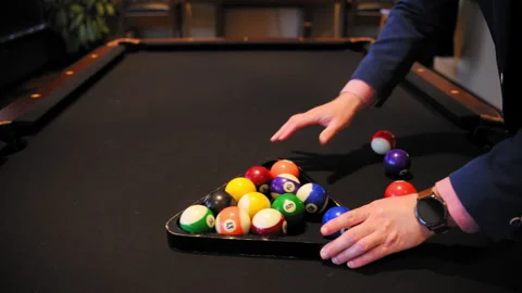 Pool Player using Wooden Rack Triangle Setting Up Billiard Balls on Table for Vidéo 313454929
