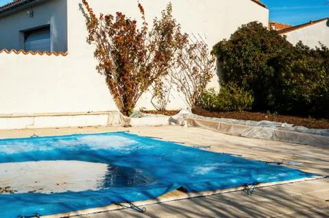 Pool protected by a pool cover during winter months Stock Photos