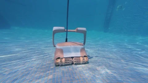Pool robot cleaning pool floor in slow motion Stock Footage 338175113