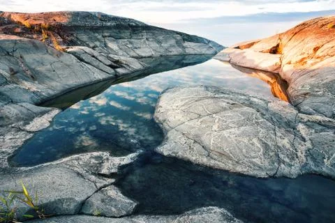 Pool in rocks on the shore Stock Photos