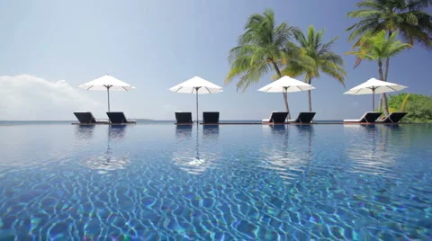 Pool scenery with four parasols Stock Footage 1008853