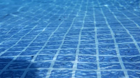 Pool Series - Underwater camera pans across the tile vinyl floor of pool Stock Footage 314626885
