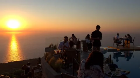 Pool side fine dining with amazing sunset view. Video stock 158876754