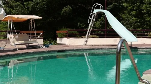 Pool with slide and swing Stock Footage 77048169