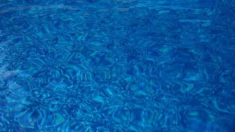Pool splash rippling the surface of the water Stock-Footage 104659005