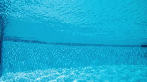 Pool. Subjective camera emerges from the bottom of the pool Stock Footage 107515636