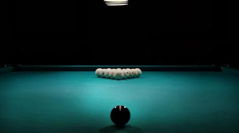 Pool table with balls and cue Stock Photos