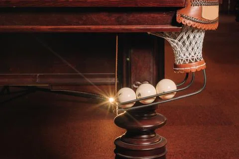 A pool table with balls that have already been played in the pool club.Playin Stockfoto's
