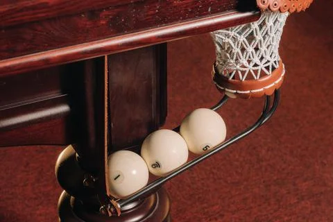 A pool table with balls that have already been played in the pool club.Playin Stockfoto's