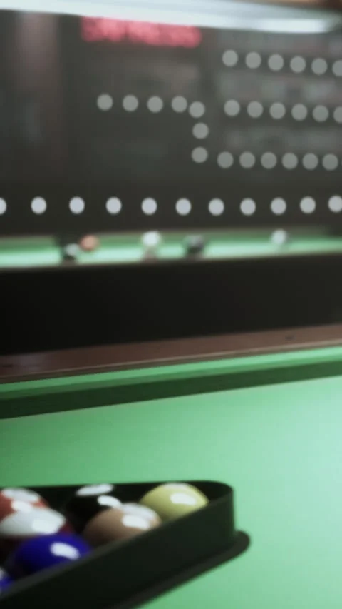 Pool table with balls ready for a game inside a recreational space Stock Footage 339507301