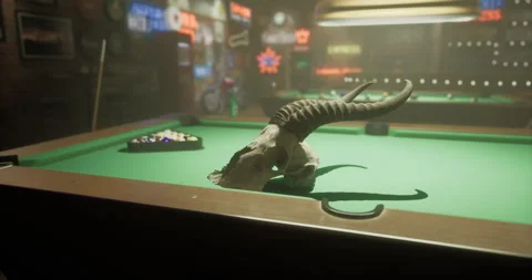 Pool table with bull skull and colorful bar decorations in a dimly lit room Stock Footage 315695638
