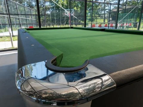 Pool table corner in a glass-enclosed area Stock-Fotos