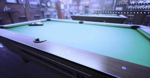 Pool table ready for a game in a dimly lit bar during evening hours Stock Illustration
