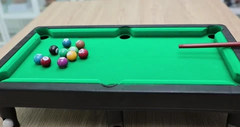 Pool table set up with balls and cue ready to play Video stock 291920899