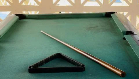 Pool table without balls in the hotel in the open air under a canopy. Stock Photos