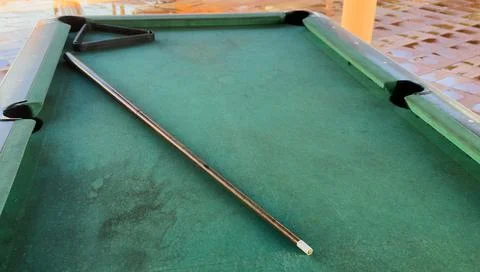 Pool table without balls in the hotel in the open air under a canopy. Stock Photos