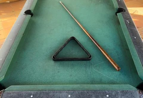 Pool table without balls in the hotel in the open air under a canopy. Stock Photos