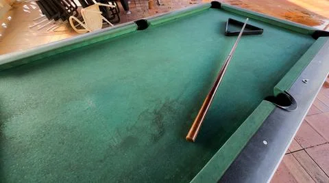 Pool table without balls in the hotel in the open air under a canopy. Stock Photos