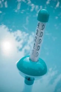 Pool thermometer in the water Stock Photos