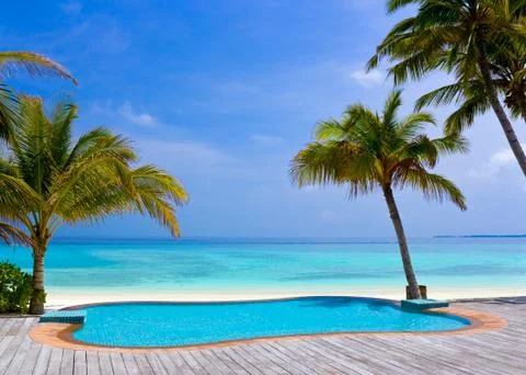 Pool on a tropical beach Stock Photos