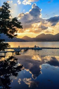 Pool at tropical beach at sunset Stock Photos
