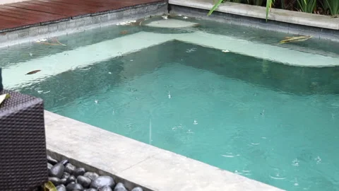 Pool under the downpour on summer rainy day. Stock Footage 158079829