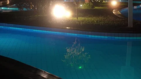Pool with warm evening lighting. Swimming pool at night with neon light. 스톡 동영상 295424763