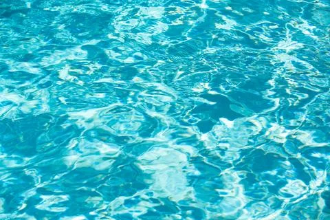 Pool water background, blue wave abstract or rippled water texture background. Stock Photos