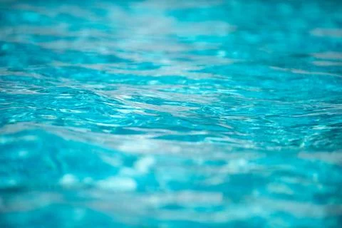 Pool water background, blue wave abstract or rippled water texture background. Stock Photos