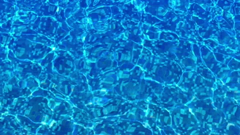 Pool water with caustics. Clear water with shining sunlights in slow motion. Stock Footage 94575339