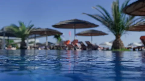 Pool water close up. Blue clear water in hotel pool on sunny day. Stock Footage 160195097