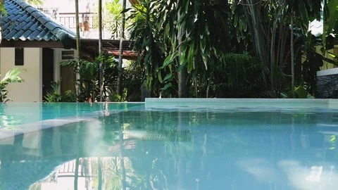 Pool water closeup. Hotel pool in the tropics. luxurious hotel pool Vídeo Stock 126313485