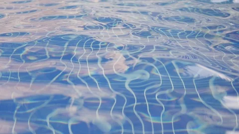 Pool water closeup. Hotel pool in the tropics. luxurious hotel pool Vídeos de archivo 127151545