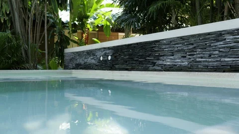 Pool water closeup. Hotel pool in the tropics. luxurious hotel pool Stock Footage 129042364