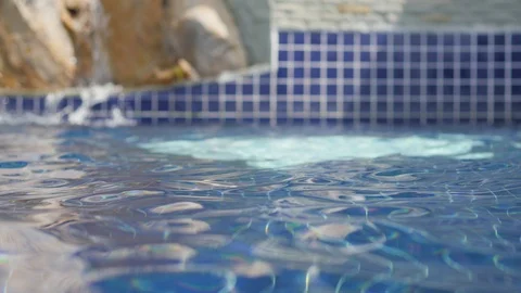 Pool water closeup. Hotel pool in the tropics. luxurious hotel pool 库存影片 129042643