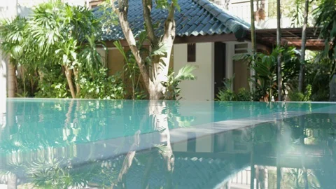 Pool water closeup. Hotel pool in the tropics. luxurious hotel pool 库存影片 130046624