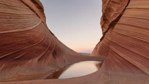 A pool of water reflect the evening sky at the Wave in Northern Arizona USA 스톡 사진