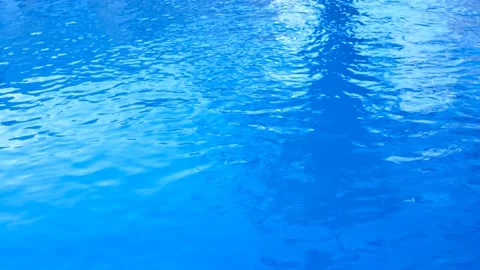 Pool water slightly moved by the wind. blue background Stock Footage 162764656