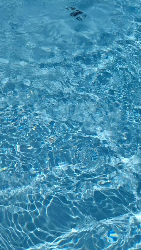 Pool Water Surface on a Hot Summer Day. Video stock 338398586