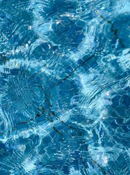 Pool water surface wave texture background. Summer holidays concept. Stock Photos